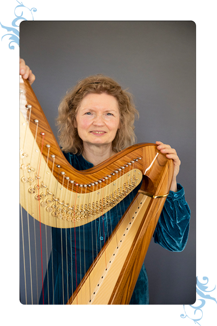 Dominique Piana playing her harp